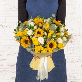 6 sunflowers, 19 yellow roses, 11 white roses accented by eucalyptus and tiny beautiful little flowers.