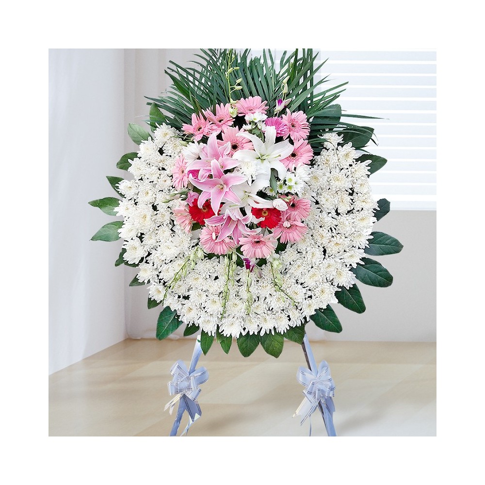 Funeral Wreath Stand - White Chrysanthemum, Green Leaves, White and Pink Lilies, Pink and Red Gerbera Daisies Funeral Wreath Stand - White Chrysanthemum, Green Leaves, White and Pink Lilies, Pink and Red Gerbera Daisies