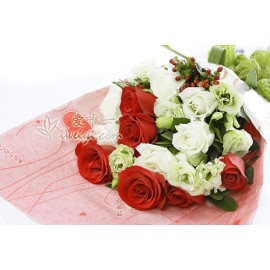 Bouquet of fresh flowers composed of 6 red roses and 6 white roses, accented with lisianthus, red hypericum and fresh greens.