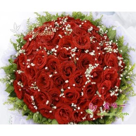 66 premium red roses accented with baby's breath, solidago and fresh greens.