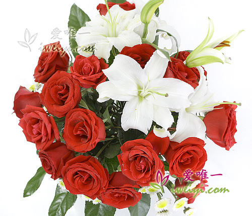 Vase of red roses and white lilies