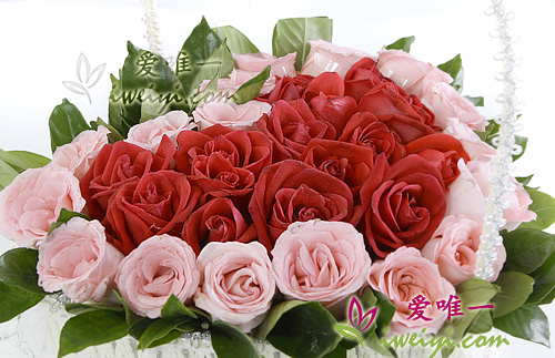 basket of flowers with red roses and pink rose