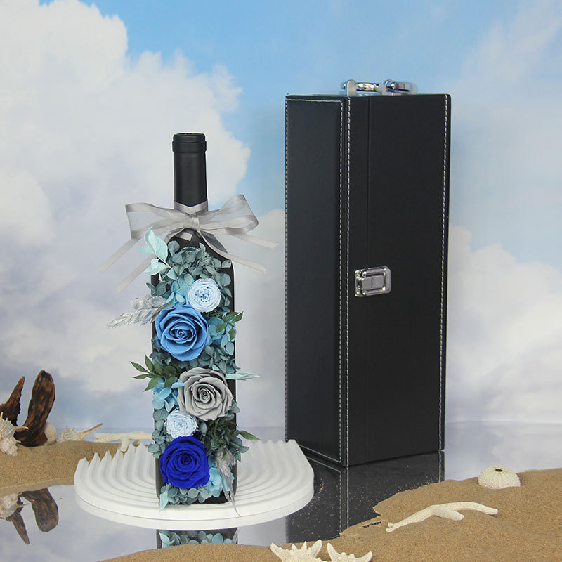 Preserved Blue Roses and Blue Hydrangea Flowers in a Bottle of Wine