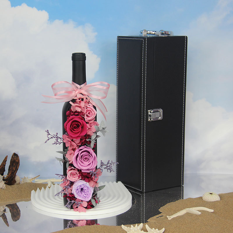 Preserved Pink Roses and Pink Hydrangea Flowers in a Bottle of Wine